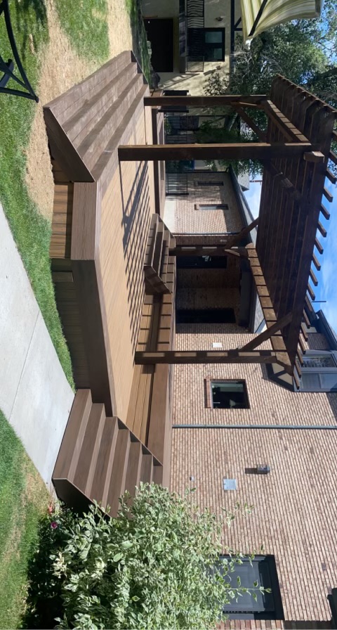Custom patio deck design with outdoor seating area
